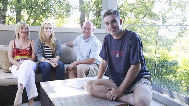 Free time: Sam Costigan (front) with his family at their Drummoyne home.