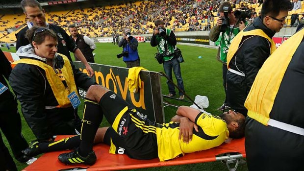 Paul Ifill is stretchered from the field with an injury during the match against Sydney FC.