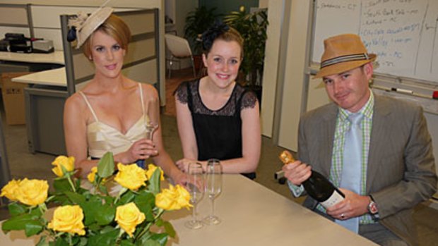 Katherine Feeney, Julia Quinn and Simon O'Brien glam up in the brisbanetimes.com.au office. Send us your office Melbourne Cup party photos.