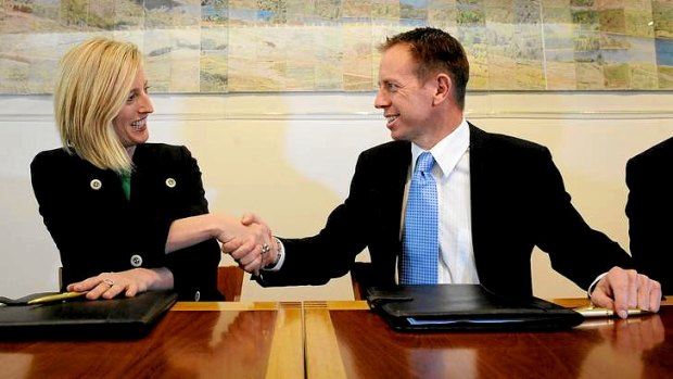 ACT Chief Minister Katy Gallagher and Greens MLA Shane Rattenbury are all smiles after signing the agreement.