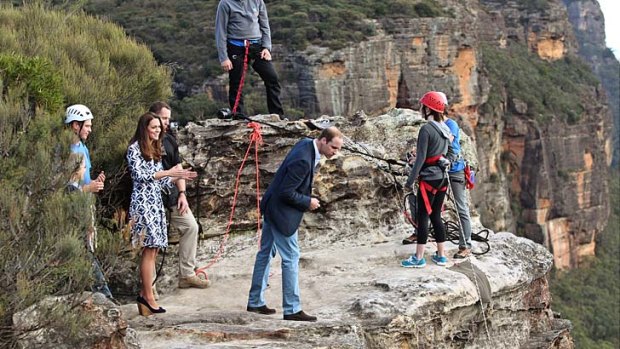 Long drop: The Duke and Duchess of Cambridge watch abseilers at Narrow Neck Lookout.