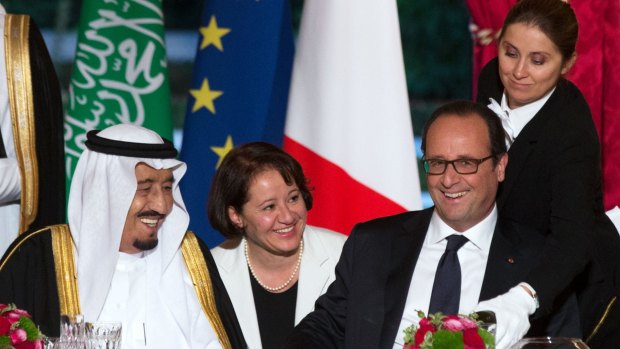 Uneasy alliance: Saudi Crown Prince Salman bin Abdulaziz al-Saud laughs with French President Francois Hollande at an official dinner in Paris.