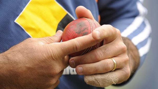 Tentative ... Ricky Ponting holds the ball gingerly at the MCG yesterday.