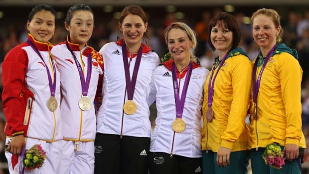 Anna Meares, fifth right, and Kaarle McCulloch, far right, show off their bronze medals. The Chinese pair, left, were relegated to silver, handing the gold to the German duo, centre.