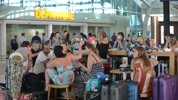 Thousands are stranded in Bali as airport closes due to volcanic ash cloud.