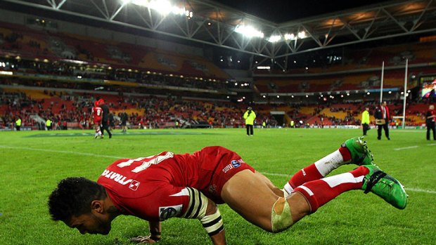 Queensland Reds winger Digby Ioane celebrates last year's Super Rugby title as only he can.