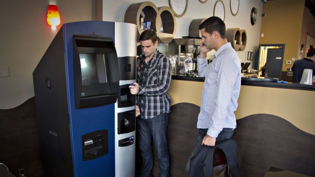 Bitcoiniacs co-founders Jackson Hudson (left) and Mitchell Demeter arrange what they say is the first bitcoin ATM.