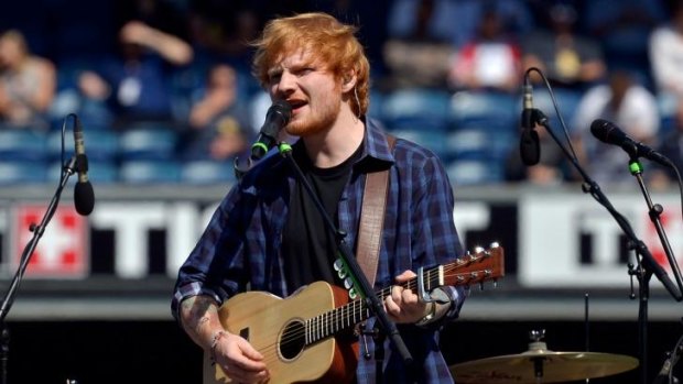Top of his game: Ed Sheeran performs at the AFL Grand Final in Melbourne in September.