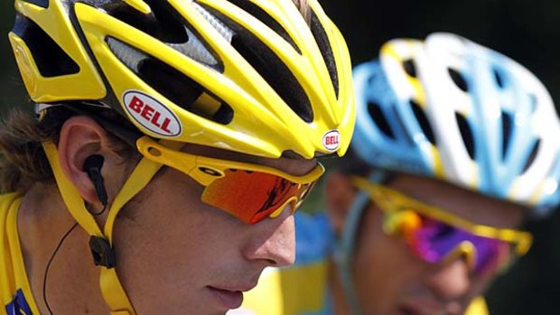 Rivals . . . race leader Andy Schleck rides with defending champion Alberto Contador.