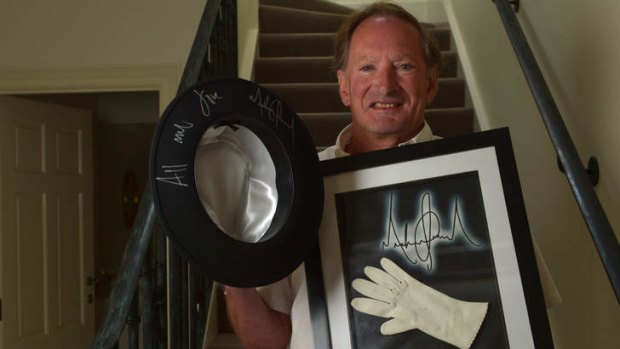 Collector of signed celebrity items Tim Fredman with a hat worn by Michael Jackson and one of the star's inner gloves.