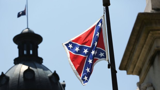 The Confederate flag is seen flying on the Capitol grounds a day after South Carolina Governor Nikki Haley announced that she will call for the Confederate flag to be removed.
