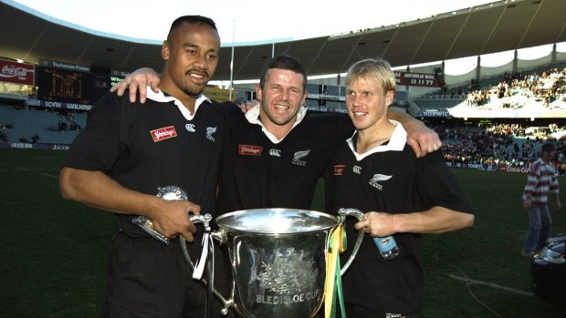 Champion: Jonah Lomu with Sean Fitzpatrick (centre) and Jeff Wilson (right) after winning the Bledisloe Cup in 1995.