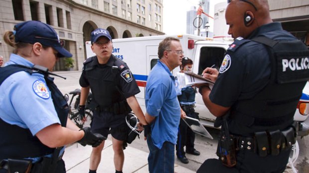 Canadian police arrest the driver of a car laden with five gas canisters a chain-saw and a home-made crossbow close to the Toronto center where G20 leaders will meet. <i>Photo: AFP/GEOFF ROBINS</i>