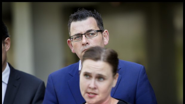 Leaning in: Premier Daniel Andrews and Emergency Services Minister Jane Garrett. 