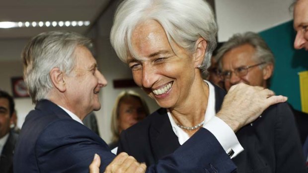 Relief ... the IMF's managing director, Christine Lagarde, and the European Central Bank President, Jean-Claude Trichet, look pleased at striking the deal.