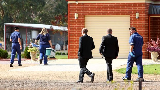 Police investigate the scene of a double homicide at the property just outside of Wangaratta.
