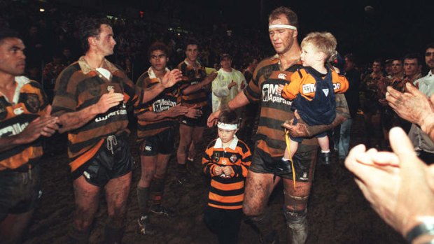 Stars in stripes: Balmain legend Paul Sironen says farewell to Leichhardt Oval in 1998. Sironen is pictured with sons Bayley (in his arms) and Curtis. Curtis Sironen plays his first NRL match at the ground on Friday night for Wests Tigers.