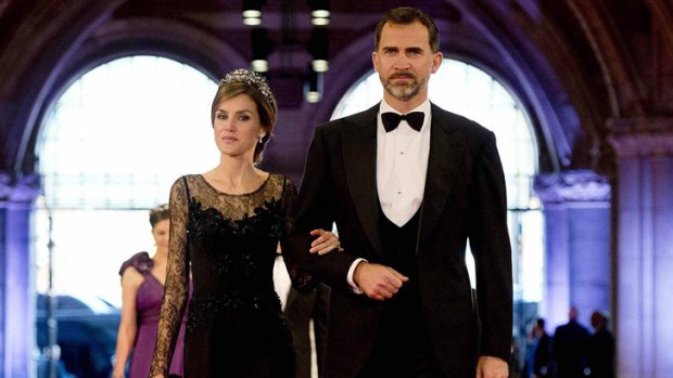 Spain's Crown Prince Felipe and his wife Princess Letizia arrive at a gala dinner organised on the eve of the abdication of Queen Beatrix of the Netherlands in April 2013.