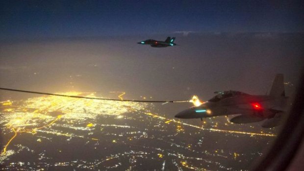 Two RAAF F/A-18F Super Hornets refuel from an RAAF KC-30A tanker aircraft above  Iraq.    