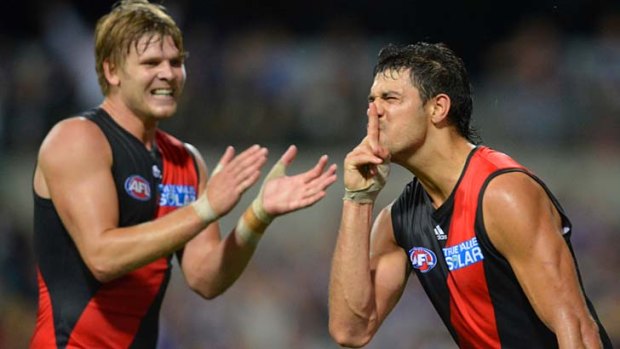 Patrick Ryder (right) celebrates after putting Essendon ahead in the closing stages of the match.