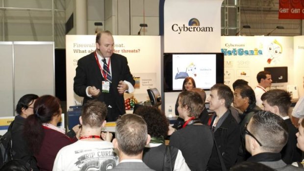 Magician David Welzman performs at a trade show.