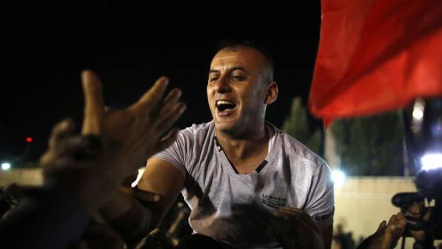 A freed Palestinian prisoner is carried upon his arrival in the West Bank city of Ramallah.