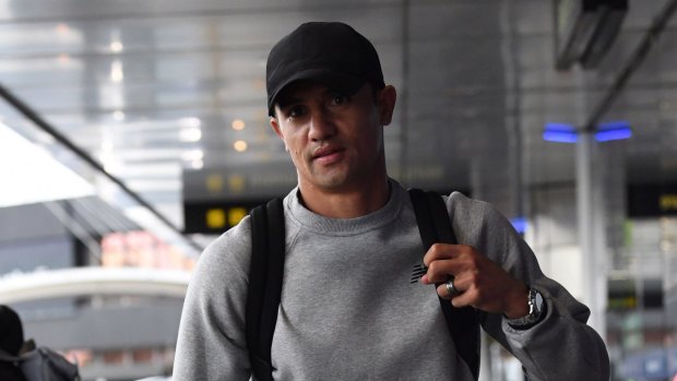 On the move: Tim Cahill at Melbourne Airport on Monday morning.