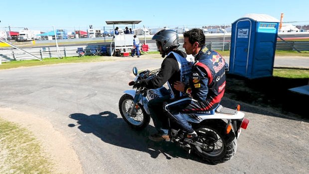 Mark Webber of Australia and Red Bull Racing is given a lift back to the pits after retiring early from the United States Formula One Grand Prix at the Circuit of the Americas in Austin, Texas.