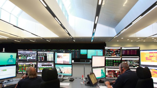 Rio Tinto staff monitor activity in the operations centre in Perth, where trucks and rigs are controlled remotely in the Pilbara mines.