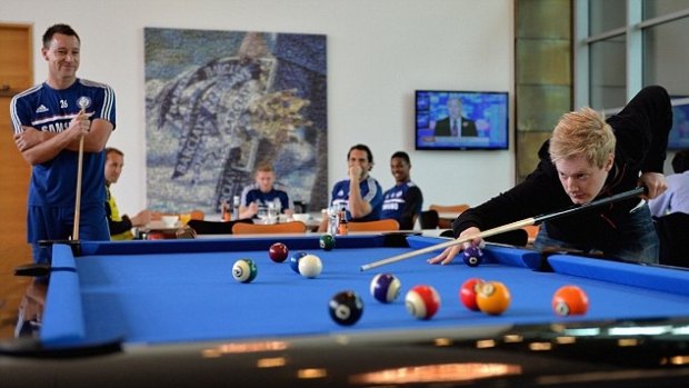Famous friends: Neil Robertson plays pool with Chelsea captain John Terry in 2013. 