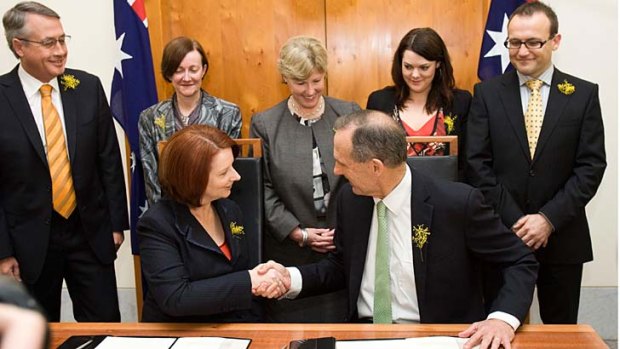 Happier times... the Greens sign off on a deal in support of Labor after the 2010 election.