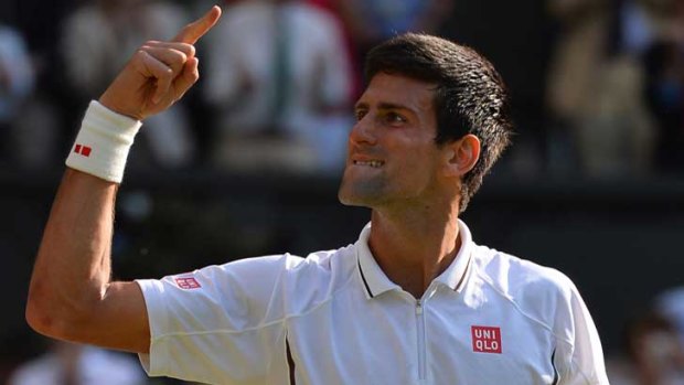 Serbia's Novak Djokovic celebrates beating Argentina's Juan Martin Del Potro during their men's singles semi-final match on day eleven of Wimbledon.