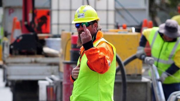 A worker at the Nishi building site expresses his displeasure at being photographed by The Canberra Times on Wednesday.