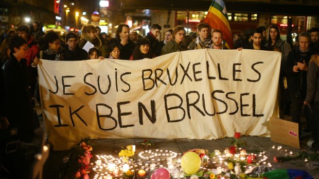 I am Brussels, the banner reads, as members of the public pour onto the streets to protest against the bombings on Tuesday morning.
