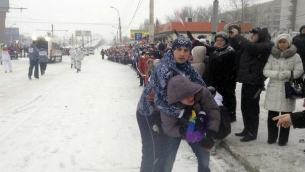 Security personnel detain Pavel Lebedev, a gay protester, during the Olympic torch relay in the city of Voronezh. 