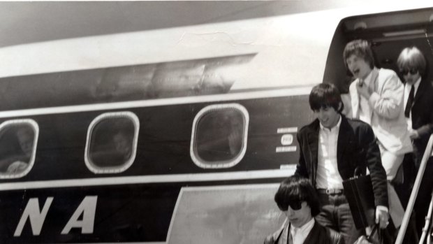 Memory lane: The Rolling Stones leave their Ansett ANA plane on arrival at Melbourne.