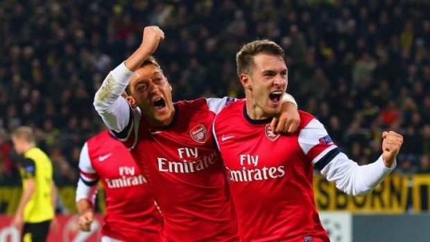 Lethal partnership: Arsenal's Mesut Oezil and Aaron Ramsey.