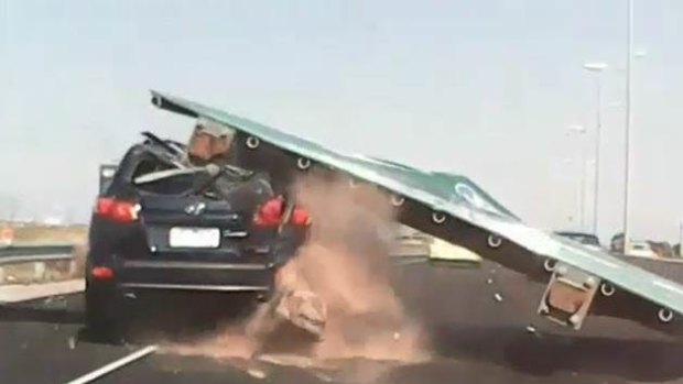 An image from dashcam footage showing the sign which fell on the Tullamarine Freeway in January.