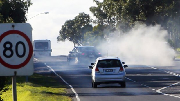 A hoon creates a cloud of smoking rubber in Hallam Road, Lynbrook, close to the scene of a weekend multiple fatality.