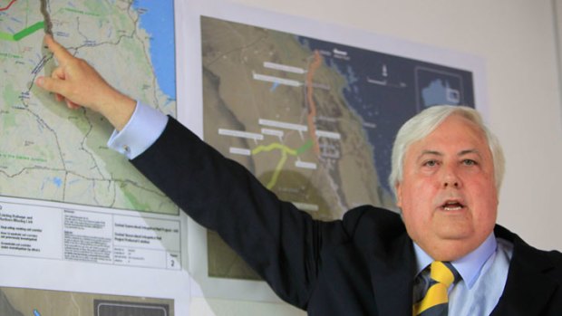 Mining magnate Clive Palmer gestures during a press conference about a proposed development in Queensland's Gallilee Basin.