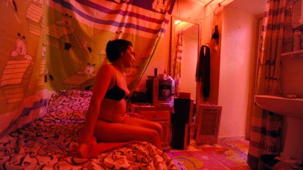A Tunisian prostitute in a brothel in the district of Abdallah Guech, Tunis.