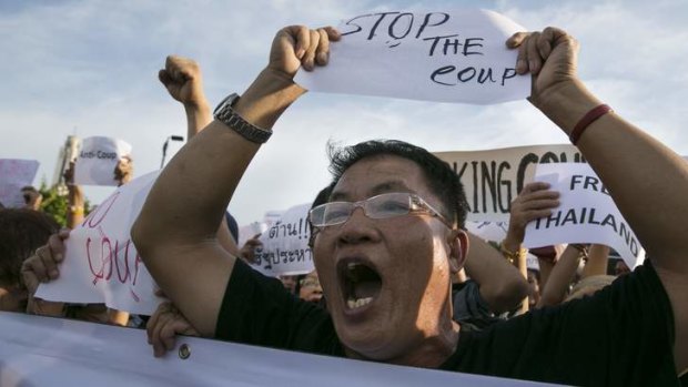 Thailand's 12th coup has been met with angry protests on the streets of Bangkok.