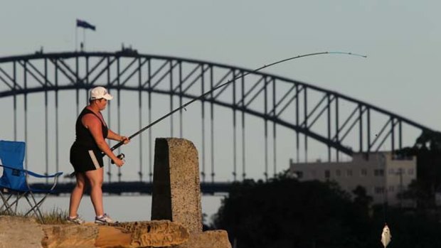 Deadly catch ... Sara Gatavi reels in a fish at Woolwich. Carcinogenic chemicals from a former pesticides factory at Homebush are spreading throughout the harbour.