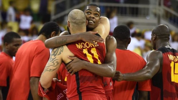 Angolan players celebrate the win.