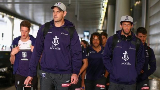Fremantle players arrive in Sydney on Friday.