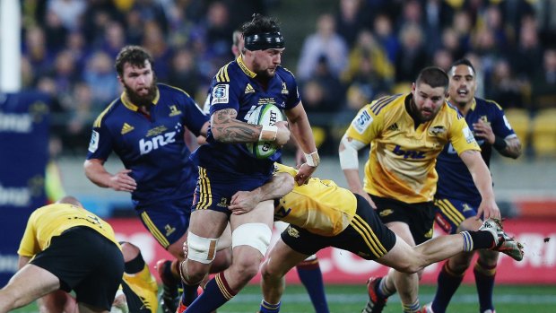 Debut: Elliot Dixon of the Highlanders on the charge against the Hurricanes this month.
