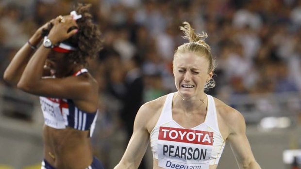 Sally Pearson in tears as she crosses the finish line to win the Women's 100m Hurdles at the World Athletics Championships.