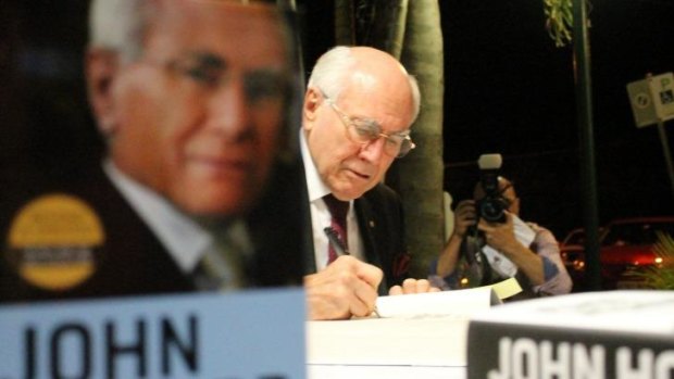 Former PM John Howard signs books in Redland City, east of Brisbane. 