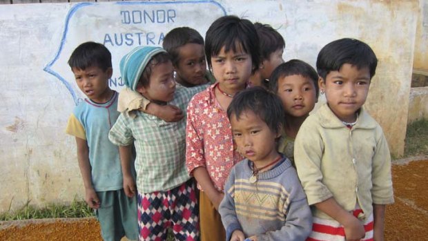 All change &#8230; children in a village in Shan state where Australian aid built a water tank.