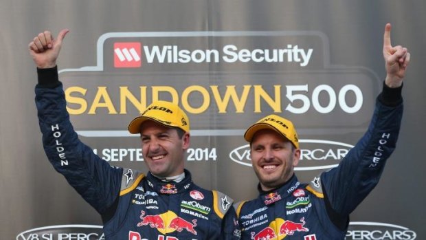 Jamie Whincup and Paul Dumbrell celebrate after they combined to win the Sandown 500.